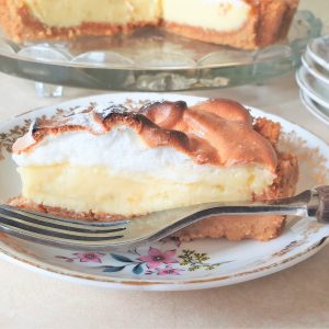 Close up of a slice of key lime pie on a plate.