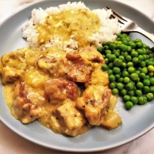 Close up of pan-fried pork with pears and onions