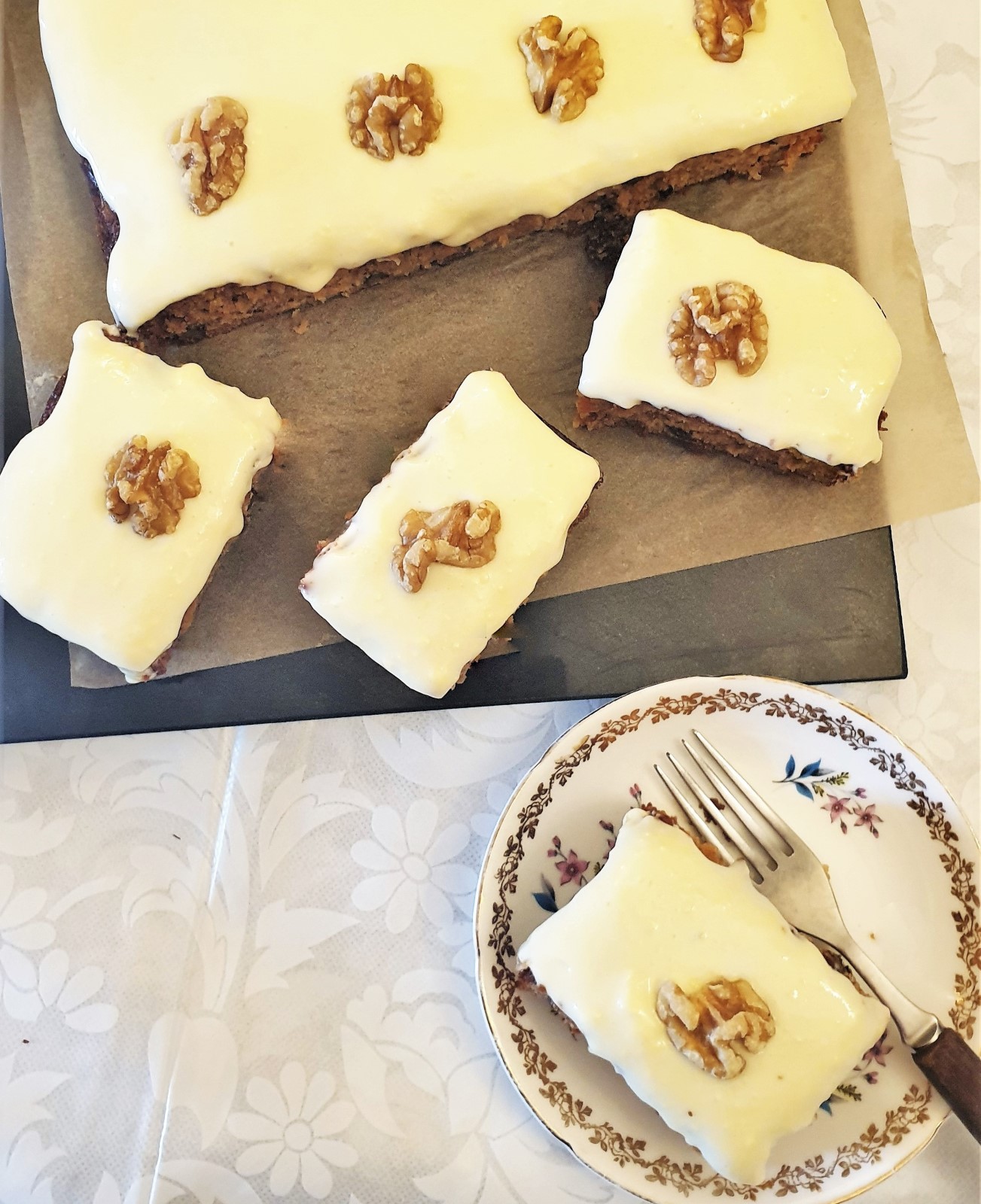 Overhead shot of slices of carrot and walnut cake.