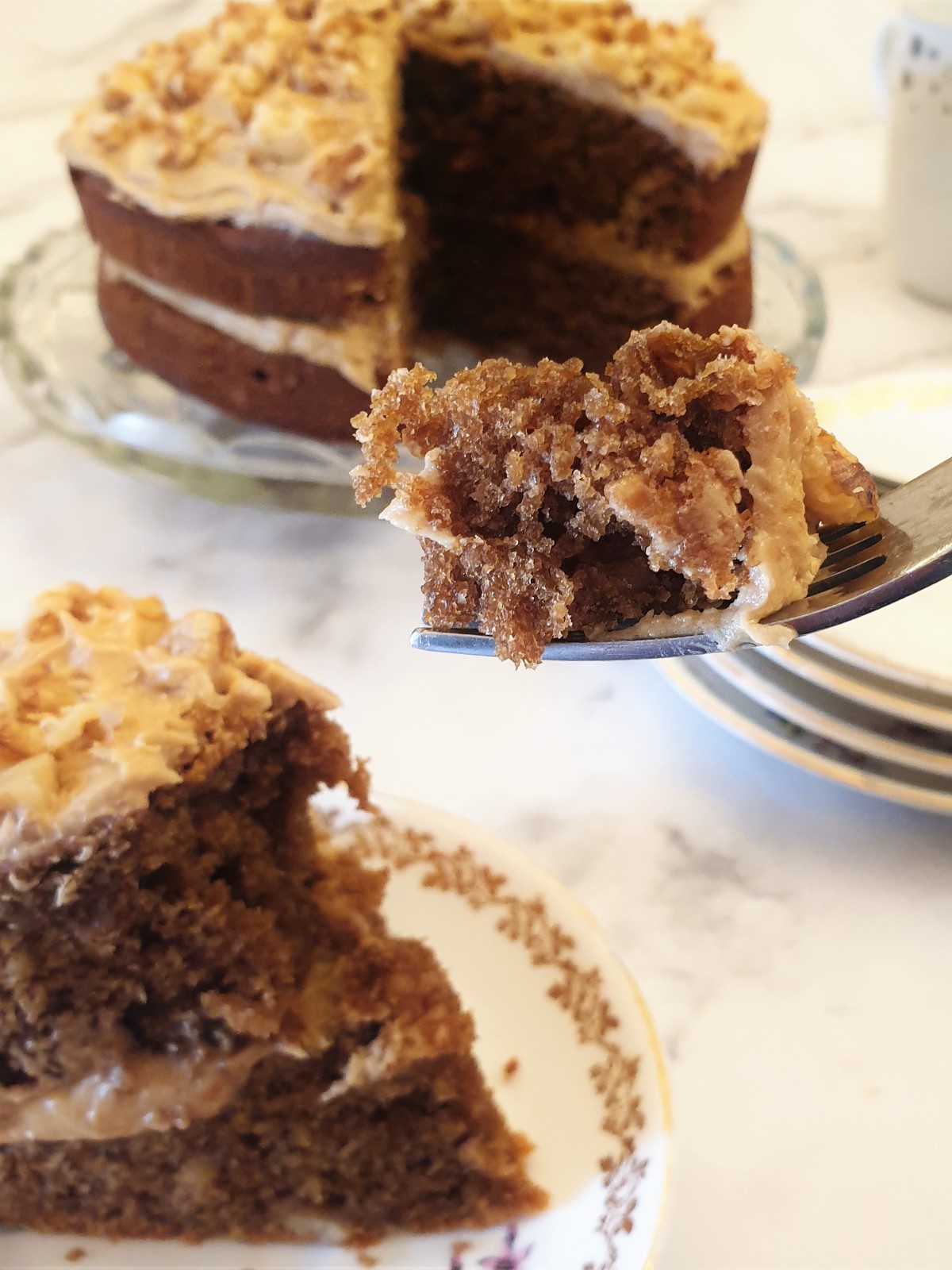 A forkful of coffee walnut cake.