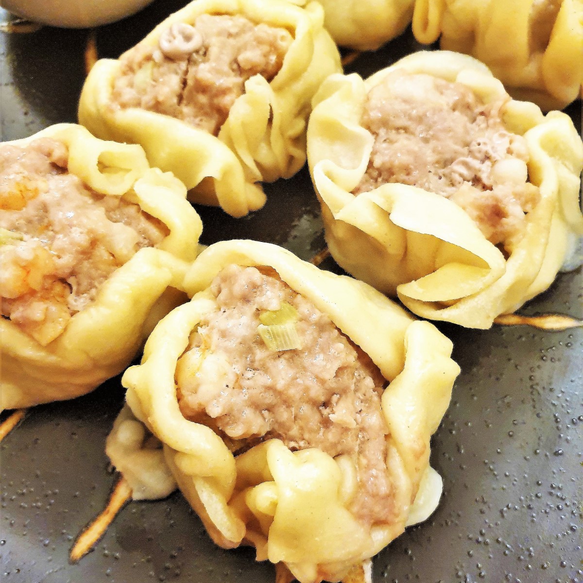 Closeup of steamed pork and shrimp dumplings.