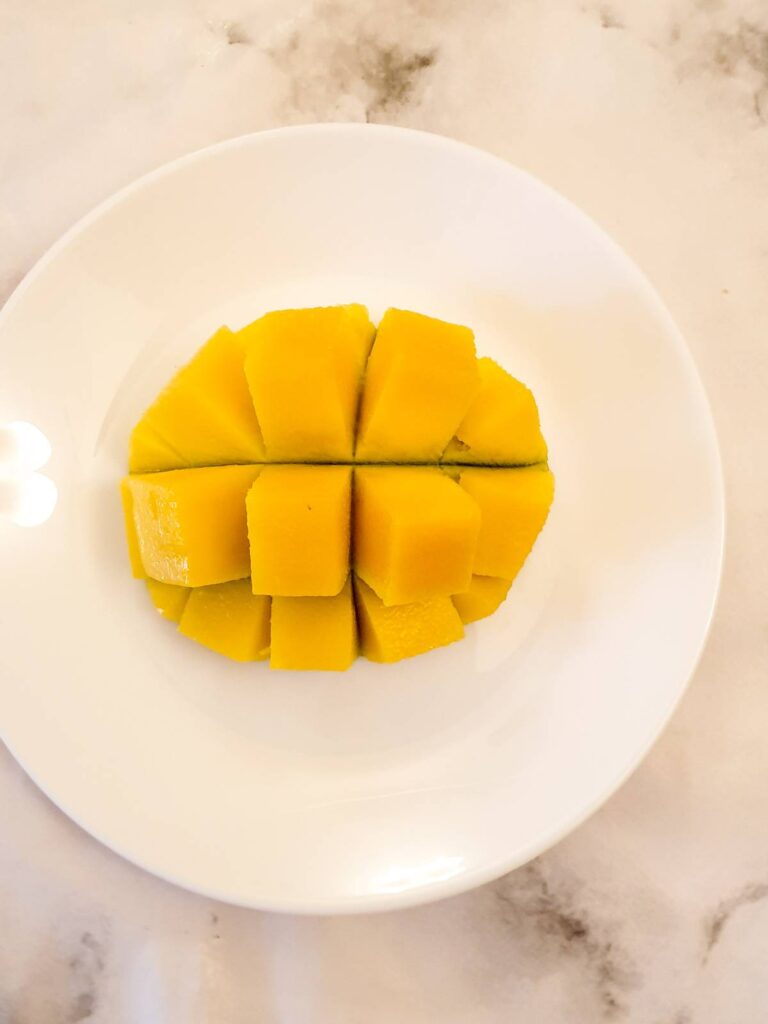 Half a mango cut into cubes.