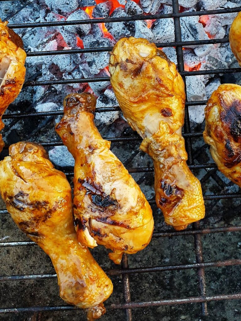 Chicken drumsticks on the barbeque grill.