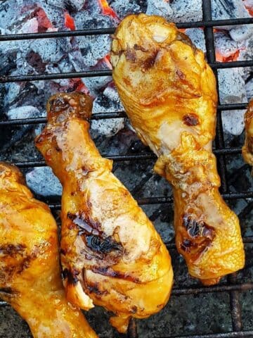 Chicken drumsticks on the barbeque grill.