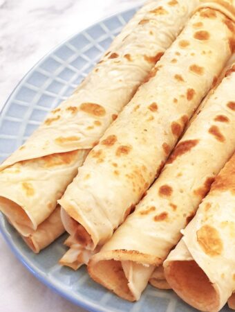 Closeup of rolled pancakes.