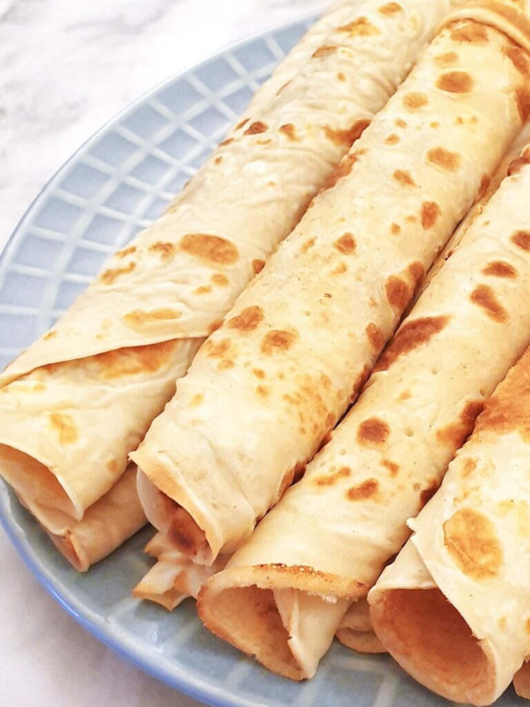 Closeup of rolled pancakes.