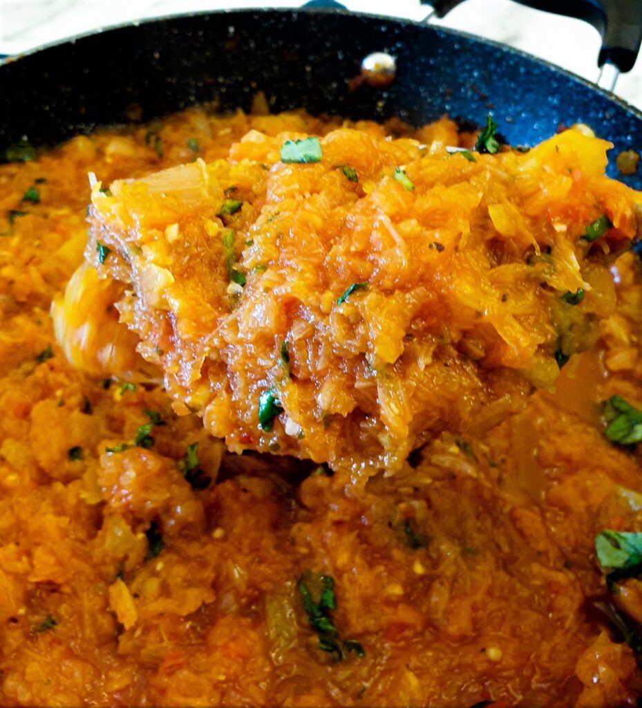 Close up of arrabbiata sauce on a spoon.