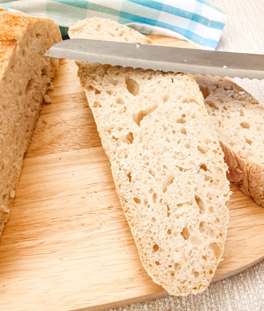 Slices of bread cut from the crusty homemade loaf.