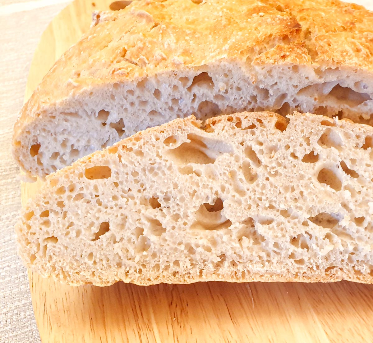 Close up of a slice of crusty homemade bread.