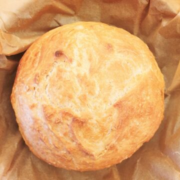 Overhead shot of a homemade loaf of crusty homemade bread.