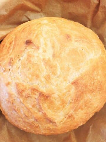 Overhead shot of a homemade loaf of crusty homemade bread.