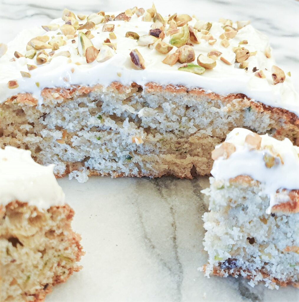 A cross-section of zucchini and pistachio cake.