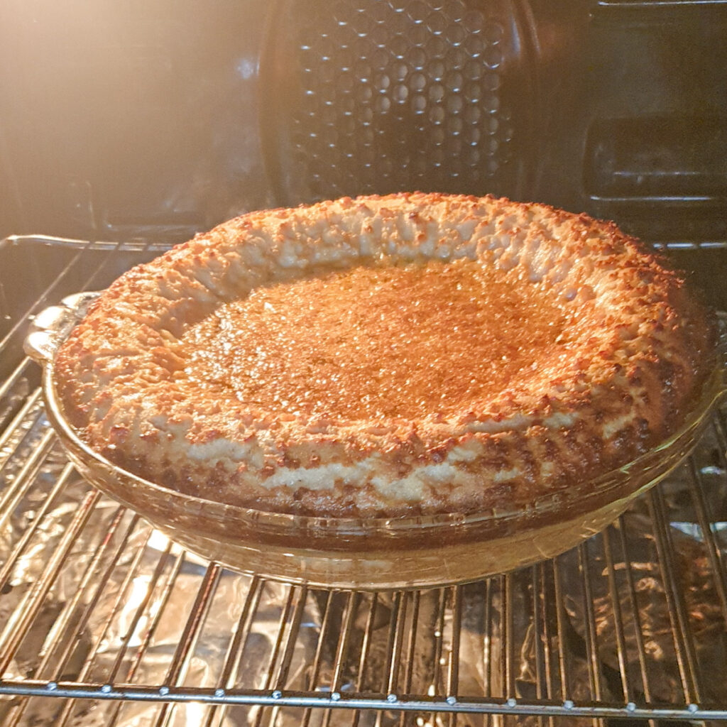 The pie baking in the oven.