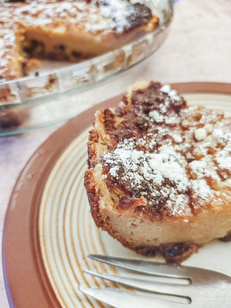 Close up of a slice of impossible Christmas pie showing the pastry on the edge.