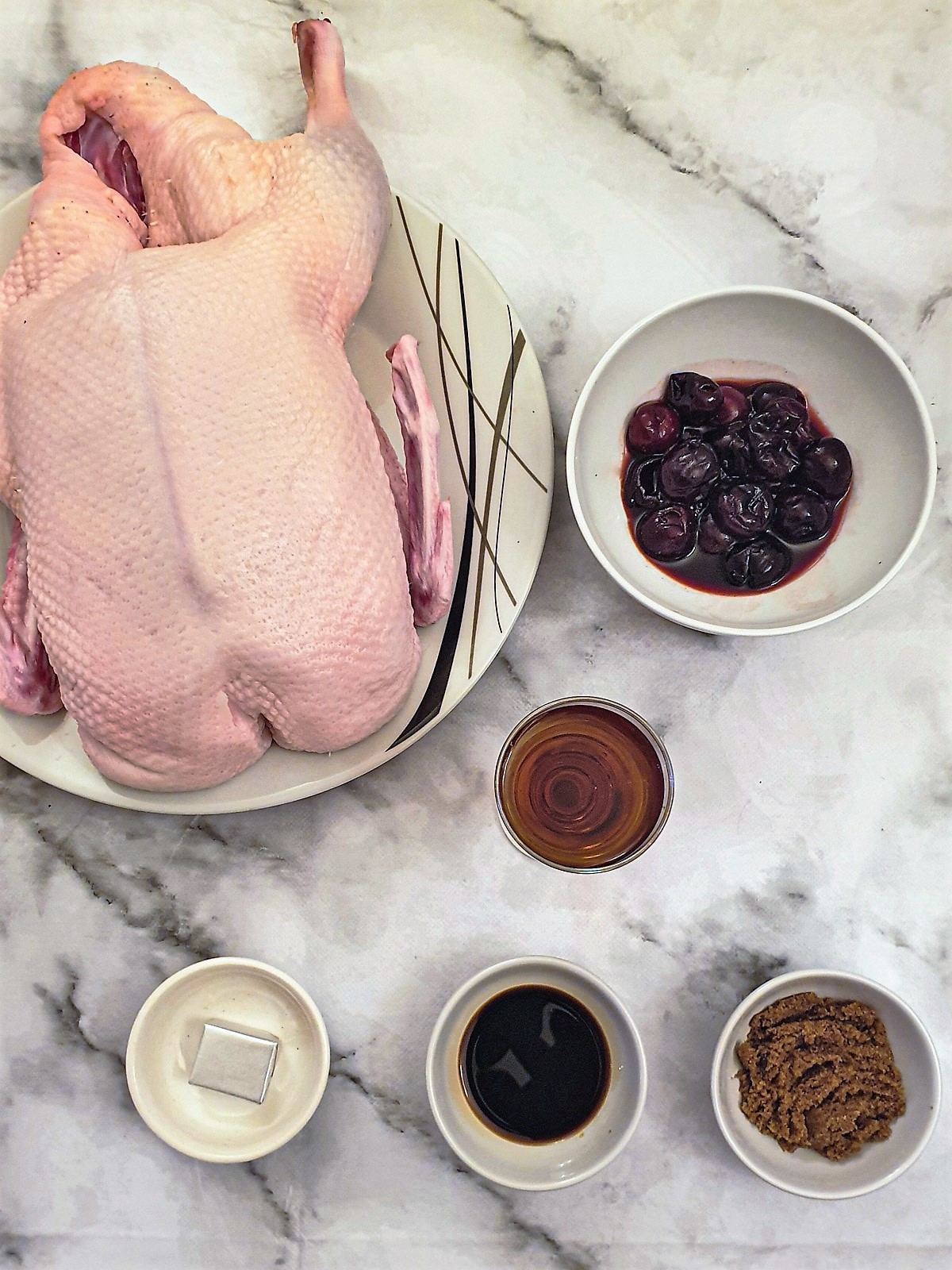 Ingredients for crispy roast duck with cherry sauce.
