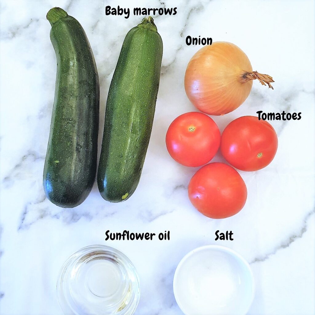 Ingredients for zucchini with tomato and onions.