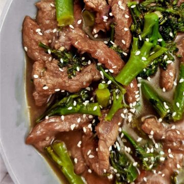 Overhead shot of beef and broccoli stir fry showing the stirps of beef and broccoli in the thick tasty sauce.