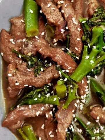 Overhead shot of beef and broccoli stir fry showing the stirps of beef and broccoli in the thick tasty sauce.