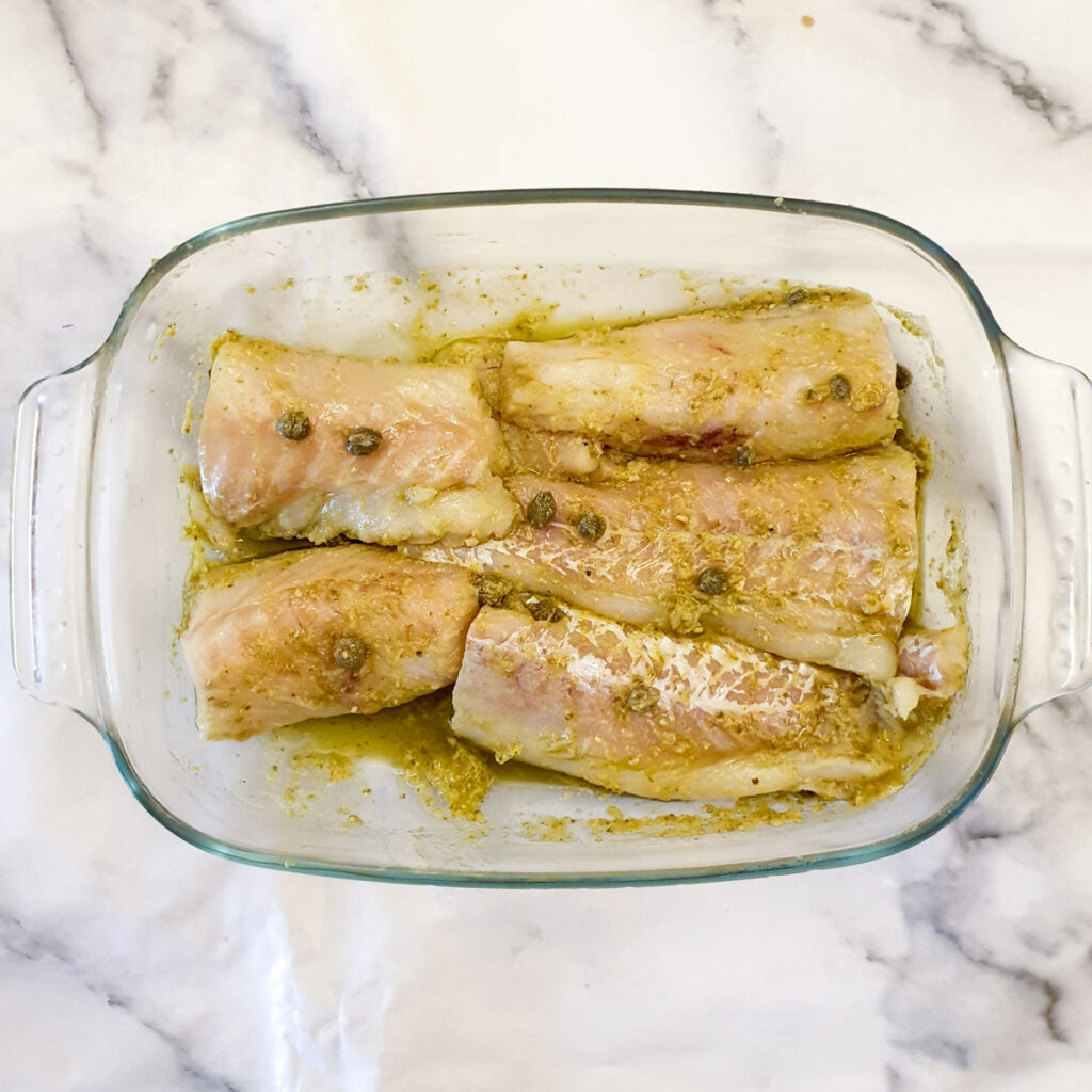 Pieces of fish in the marinade.