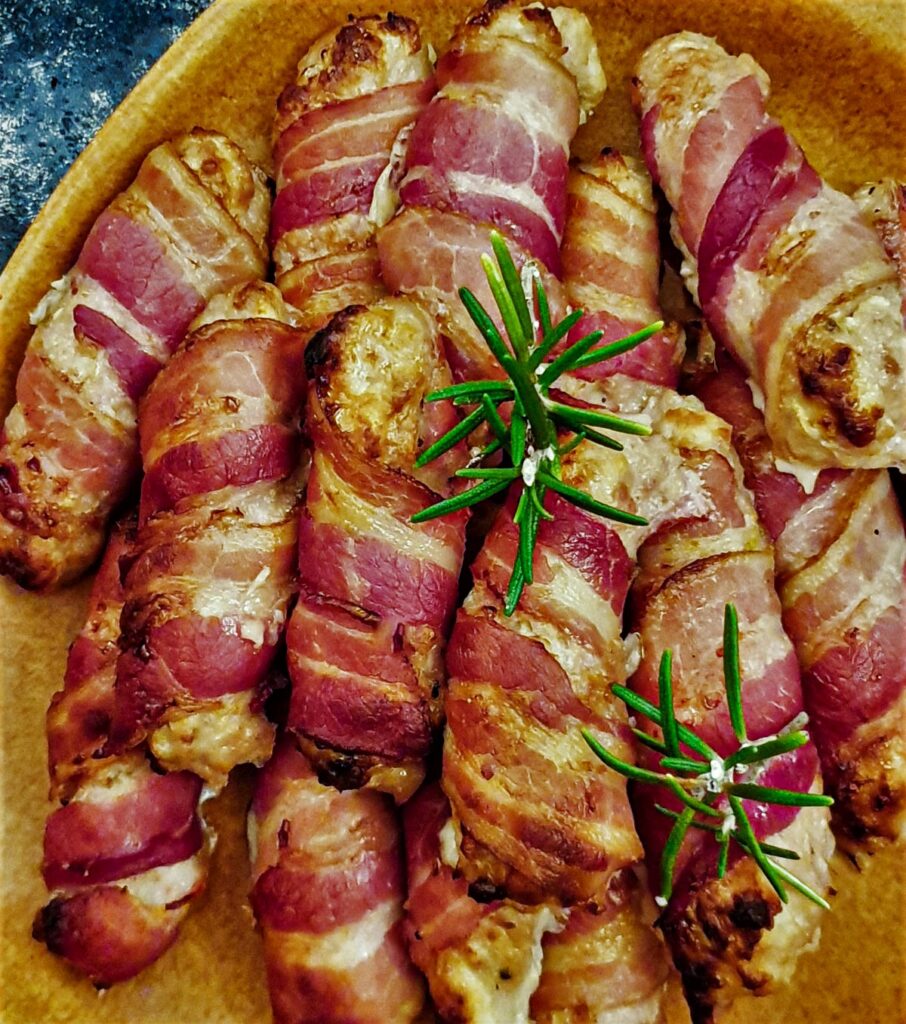 Overhead shot of a plate of pigs in blankets.
