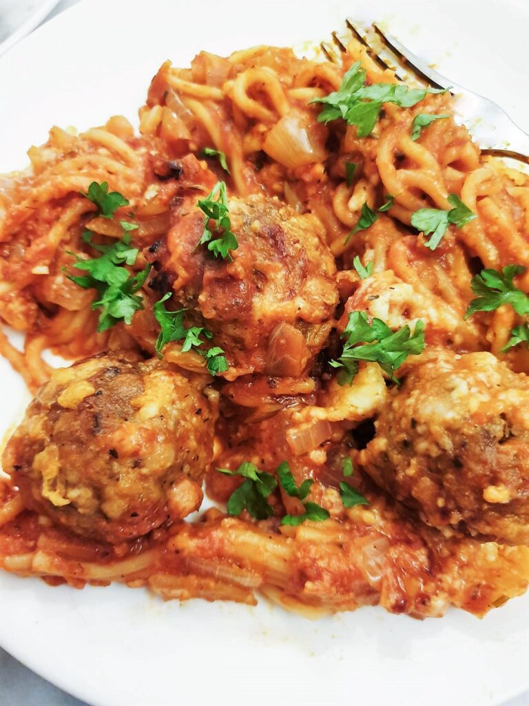 Close up of the spaghetti and meatballs on a plate.