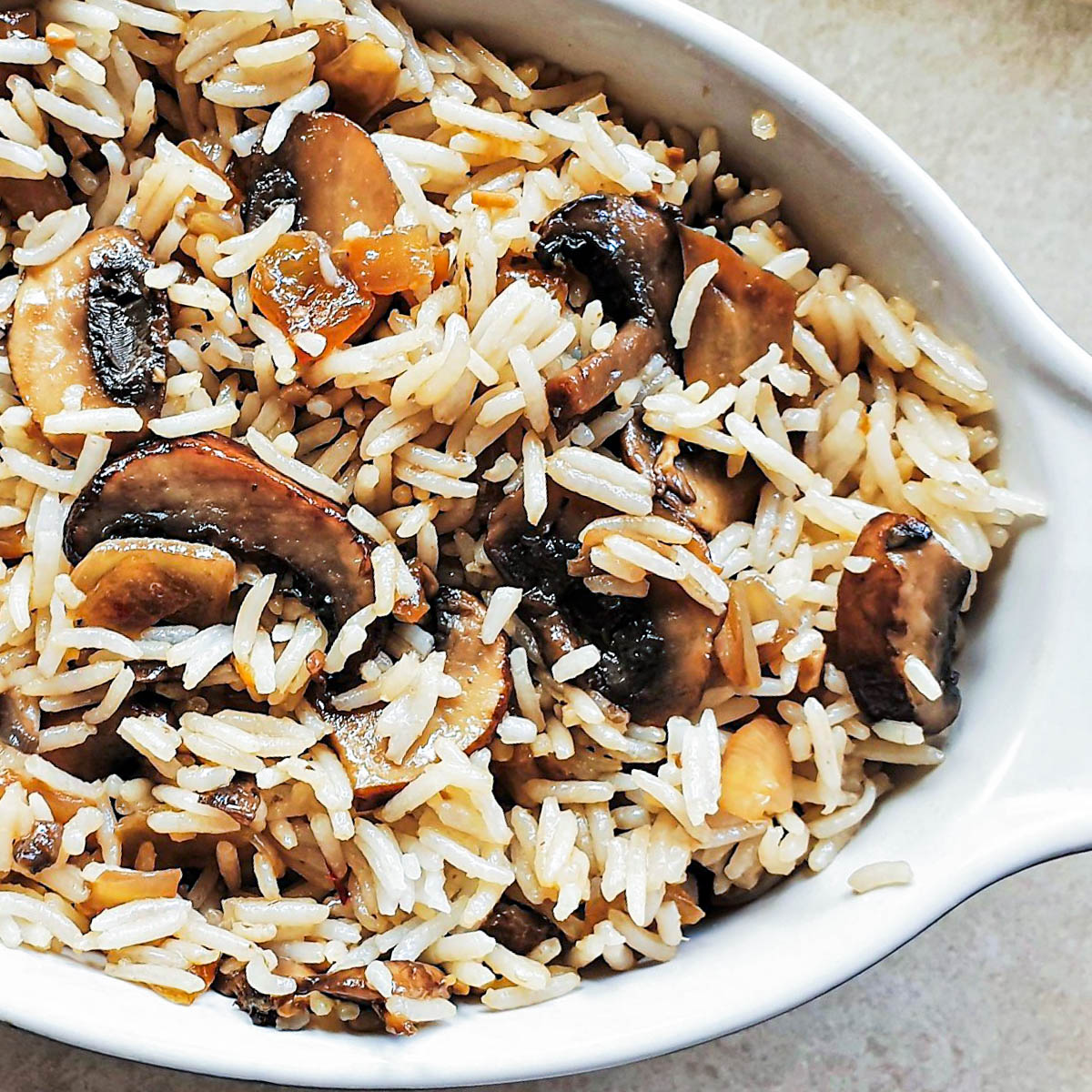 Spicy mushroom fried rice in a serving dish.
