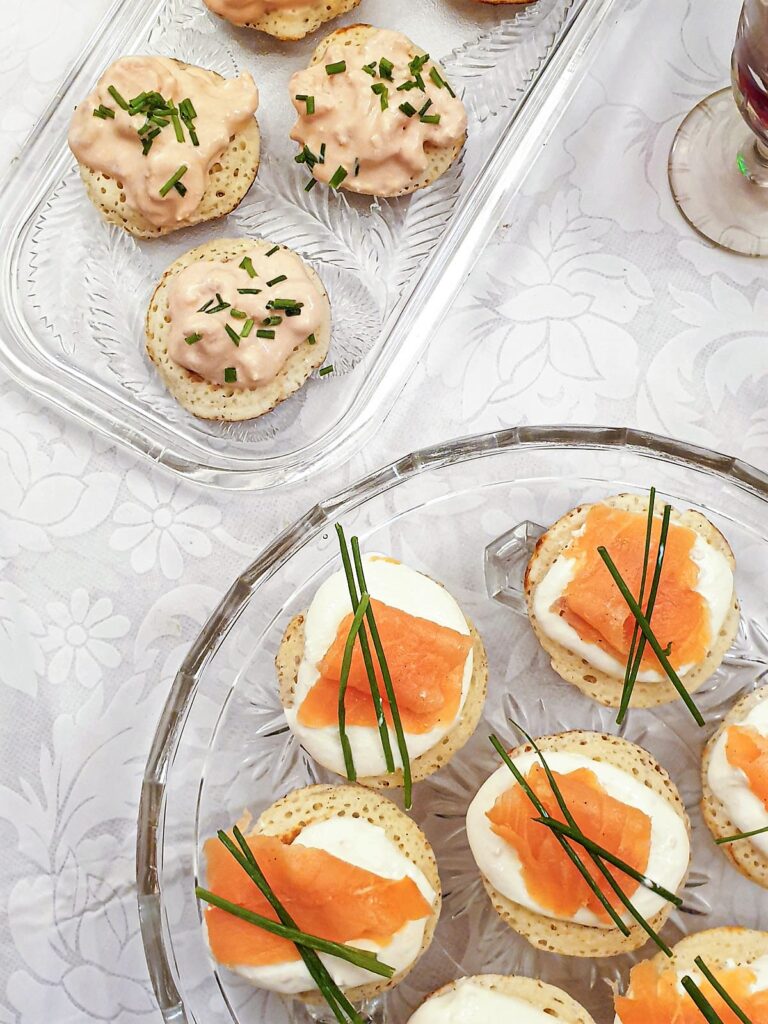 A selection of blinis with various toppings.