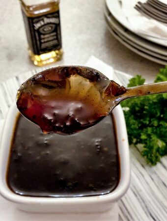 A spoonful of Jack Daniels dipping sauce showing the consistency.