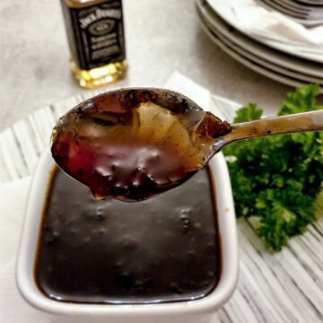 A spoonful of Jack Daniels dipping sauce showing the consistency.