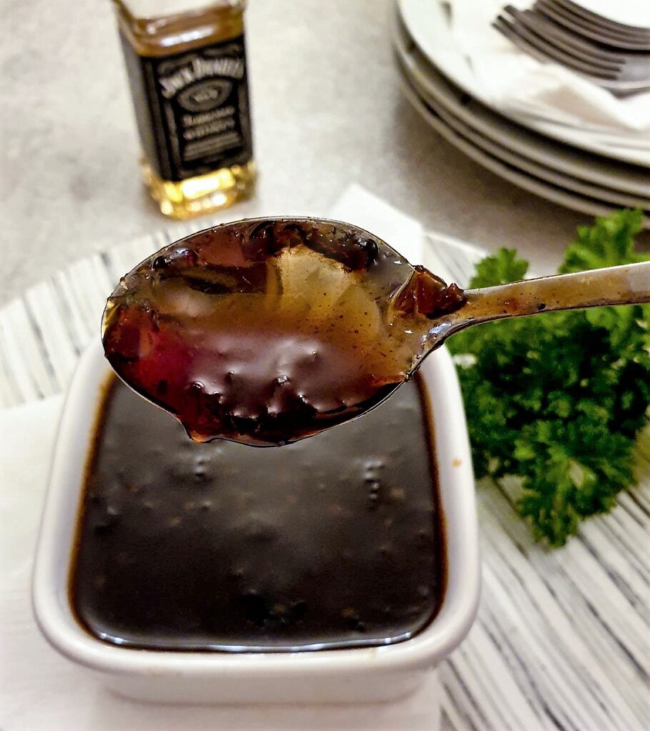 A spoonful of Jack Daniels dipping sauce showing the consistency.