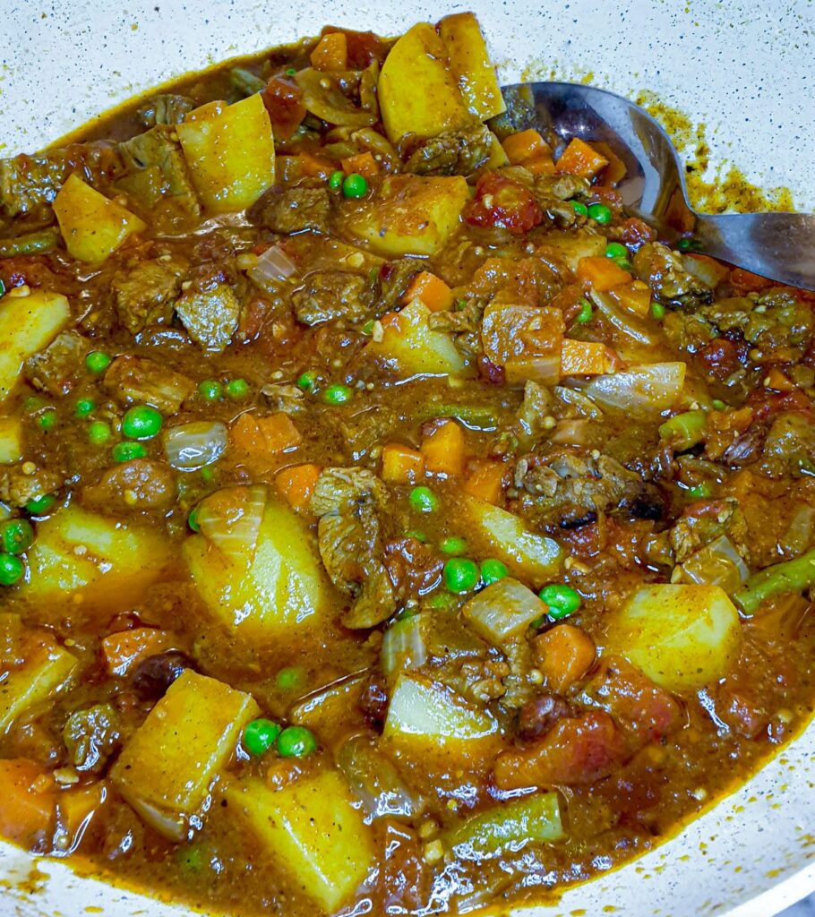 Overhead view of a bowl of lamb curry.
