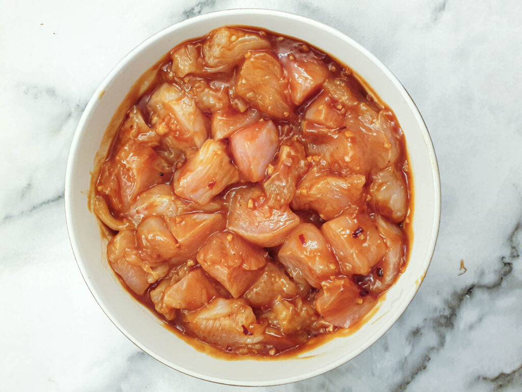 Chicken cubes marinating in the prepared marinade.