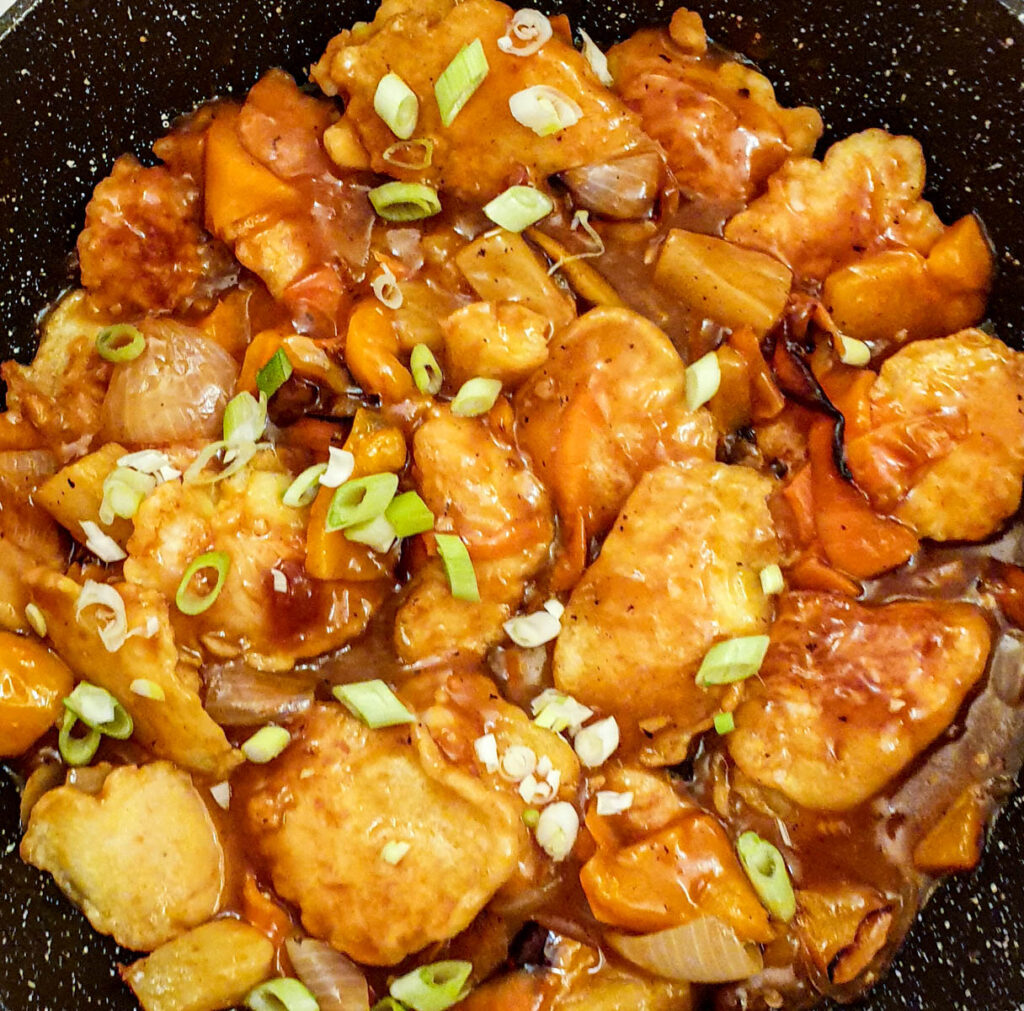 Close up of sweet and sour chicken.