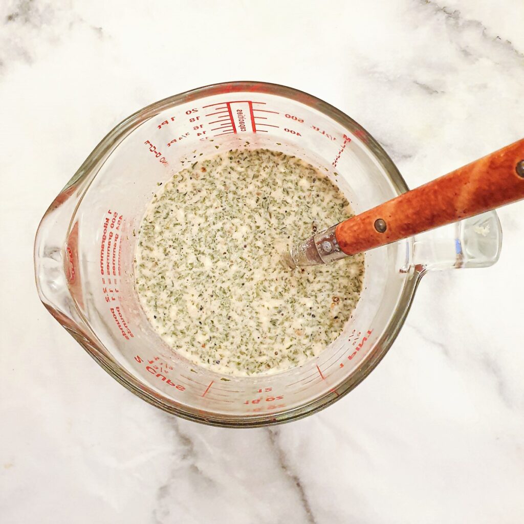 A jug of milk and cream mixed with powdered mushroom soup.