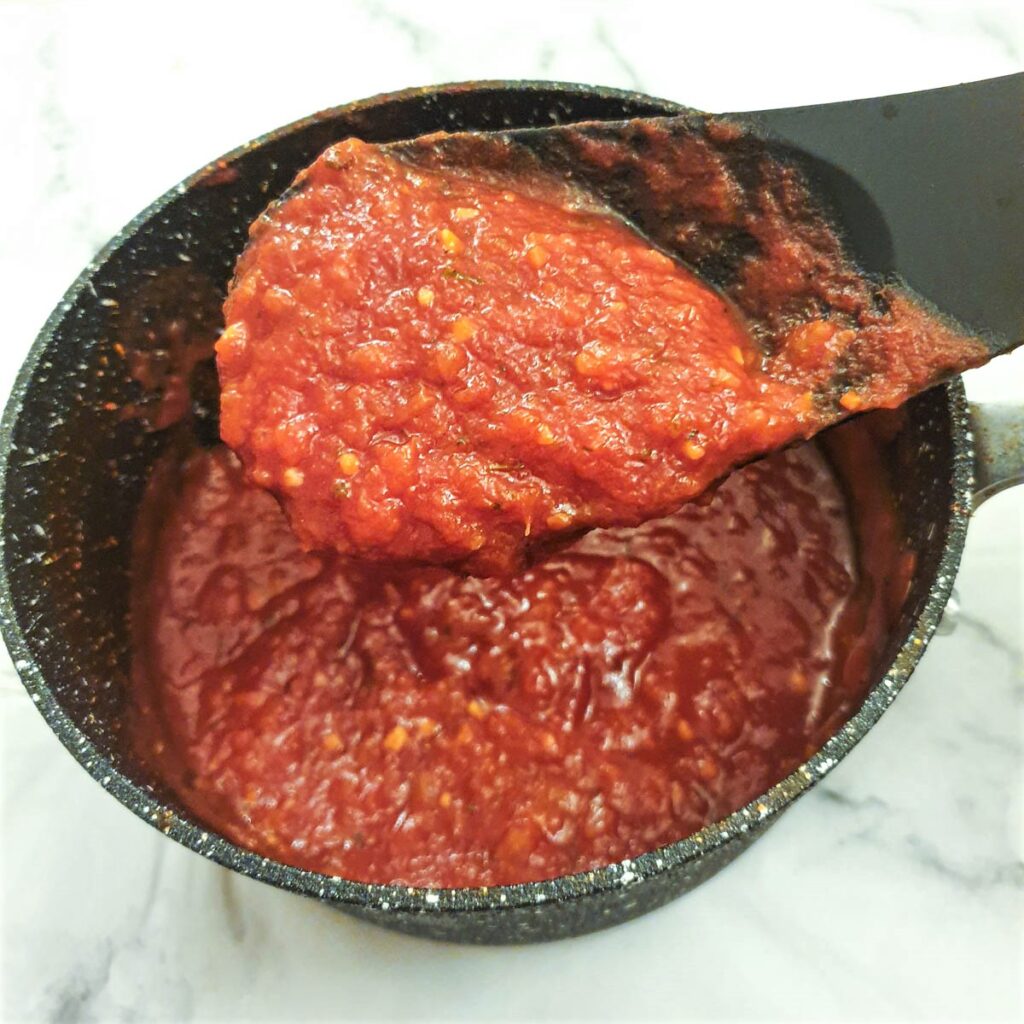 Close up the marinara sauce to show the texture.  It should be thick and glossy.