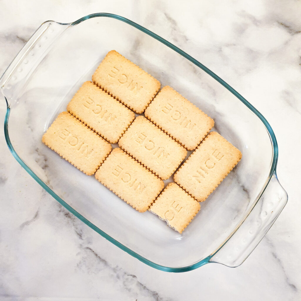 A layer of biscuits in a baking dish.