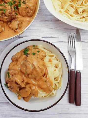 A helping of meatball stroganoff on a bed of tagliatelle.