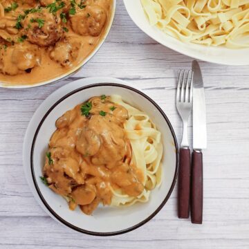 A helping of meatball stroganoff on a bed of tagliatelle.