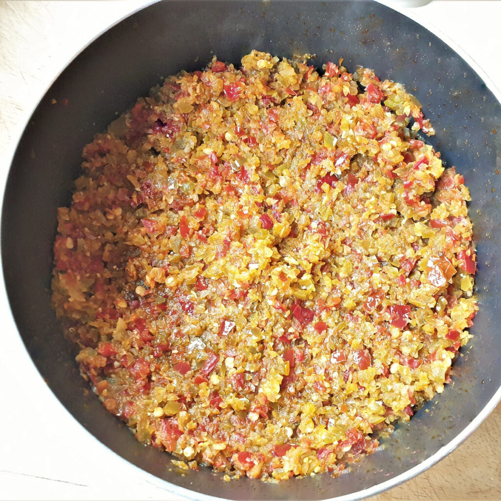 Finely processed chili, garlic and onion frying in a pan.