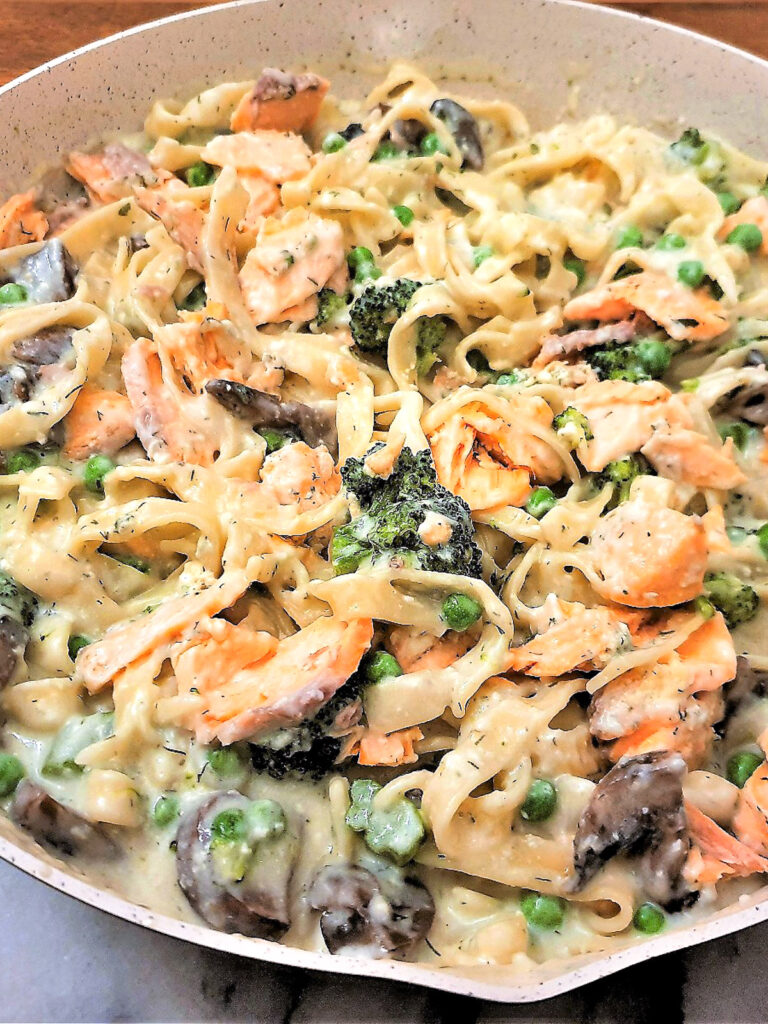 Salmon and broccoli pasta in a frying pqn.