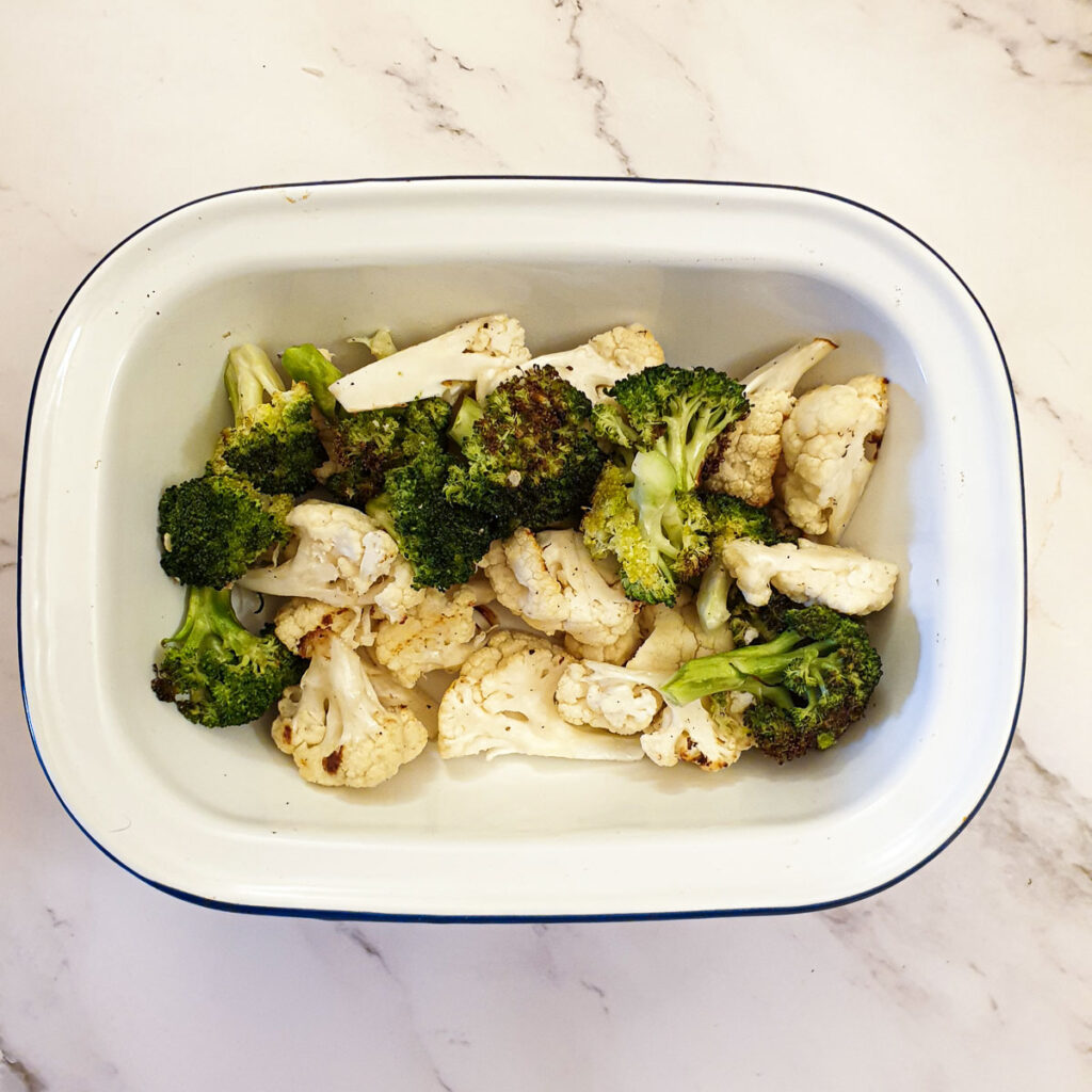 Cauliflower and broccoli in a baking dish.