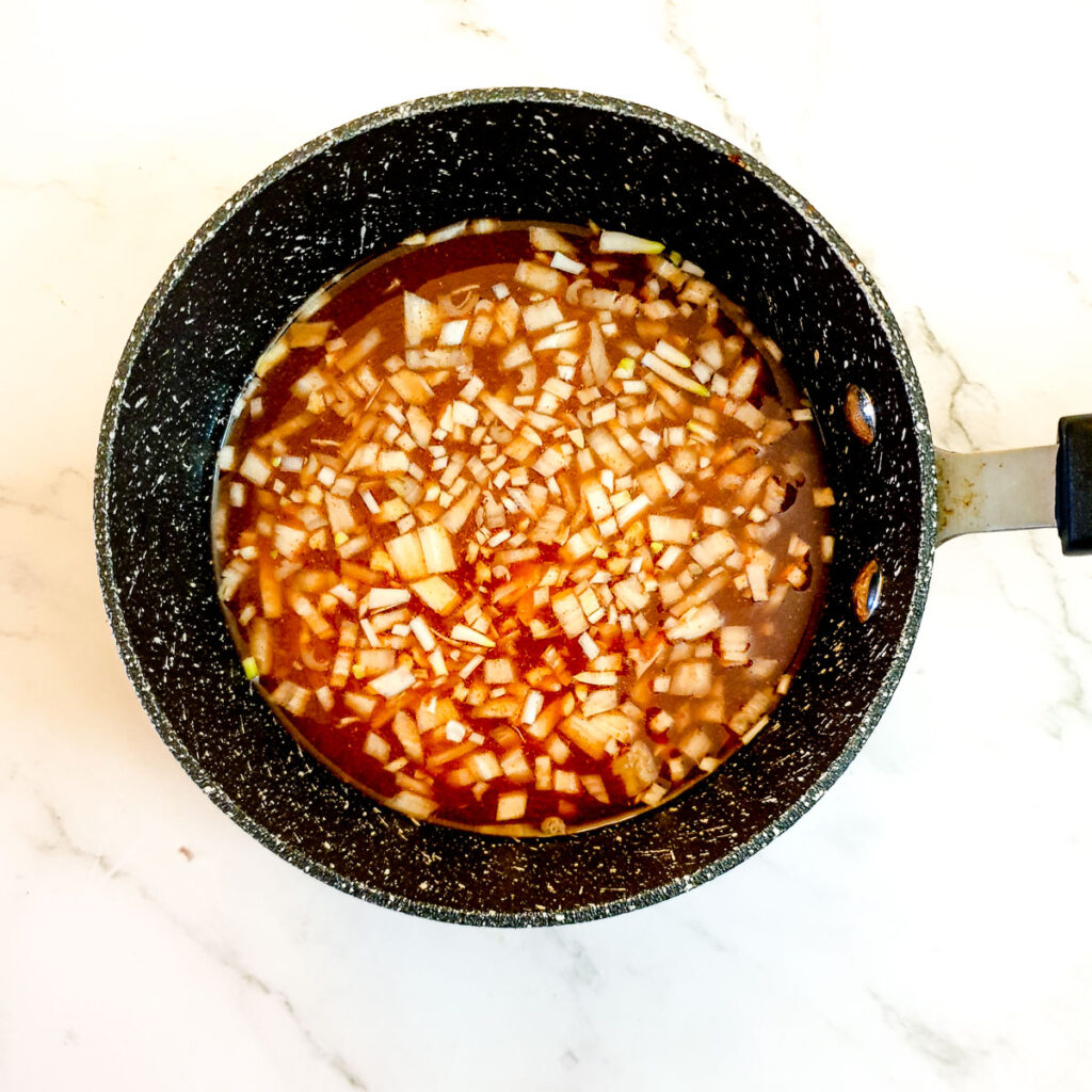 Ingredients for Durky sauce in a saucepan.