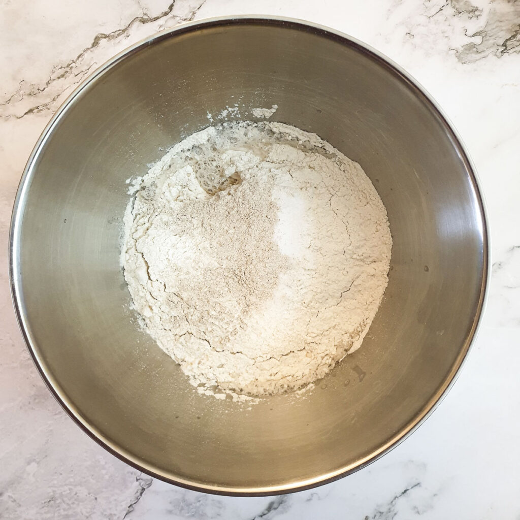 Flour, barley malt, salt and sugar added to the yeast and water.