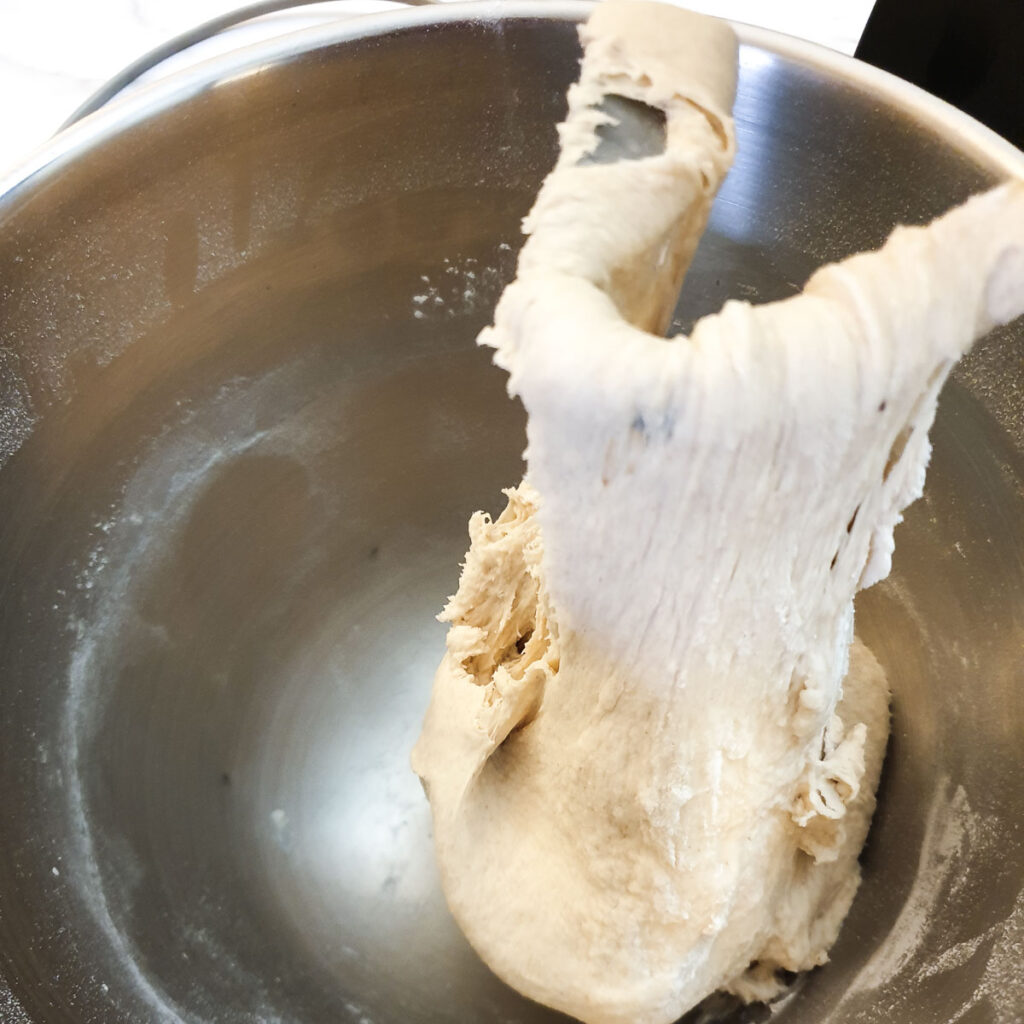Dough dropping from the dough hook after it has been kneaded for 12 minutes.