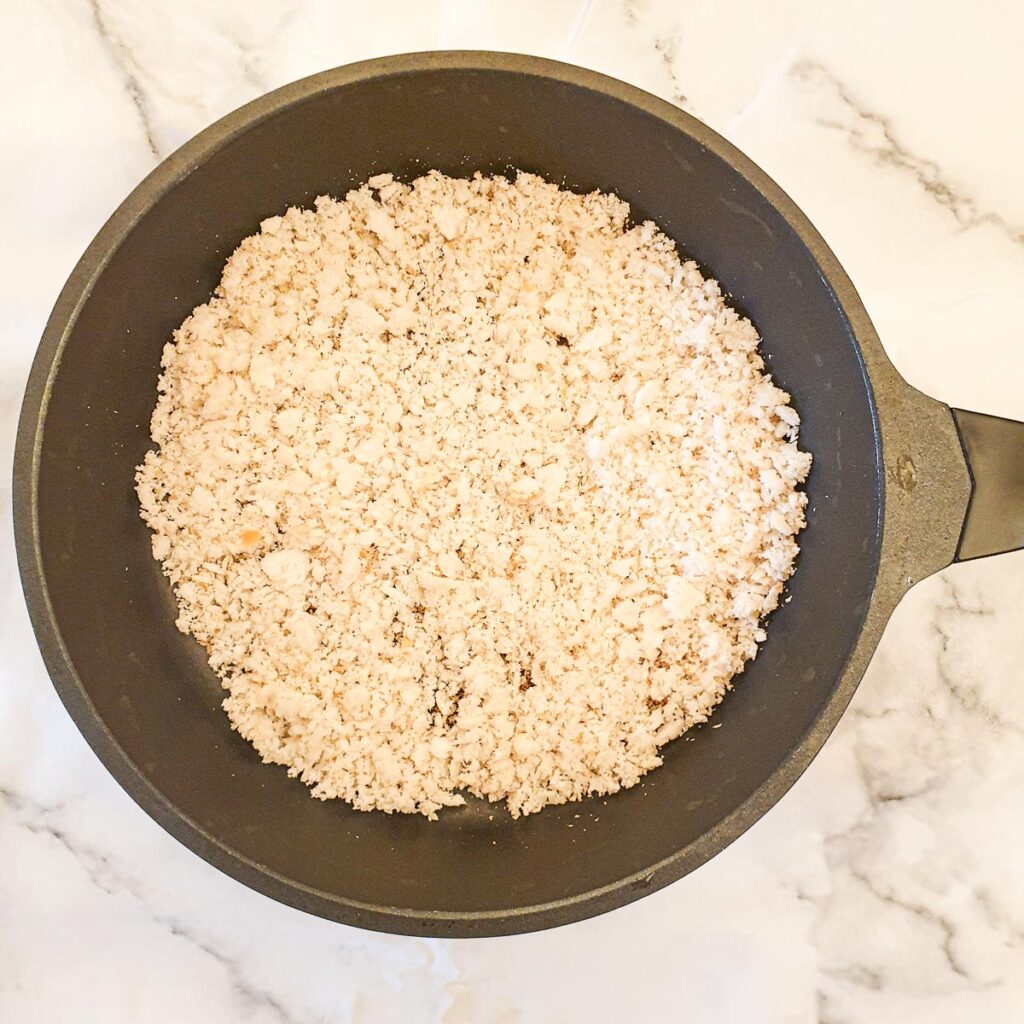 Fresh breadcrumbs in a frying pan.