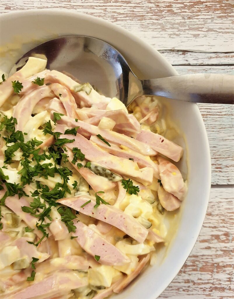 Close up of a dish of German meat salad.