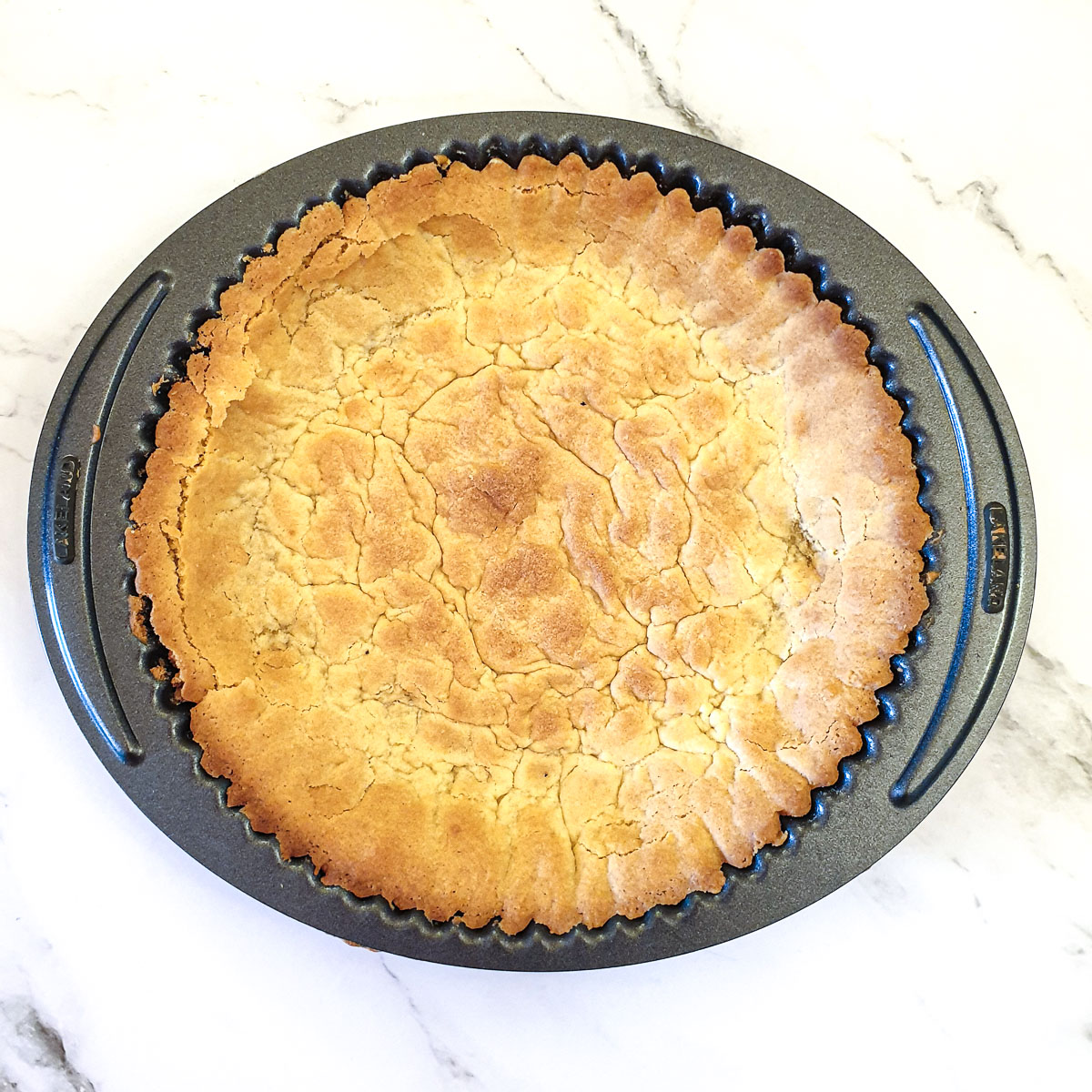 A baked pie crust ready for the milk tart filling.