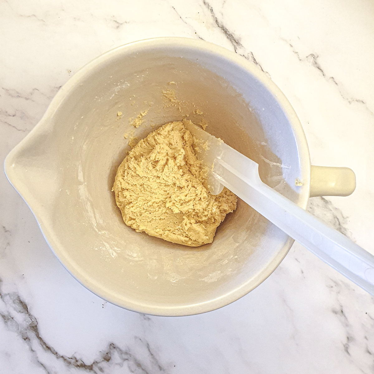 The ball of pastry after the flour has been added.