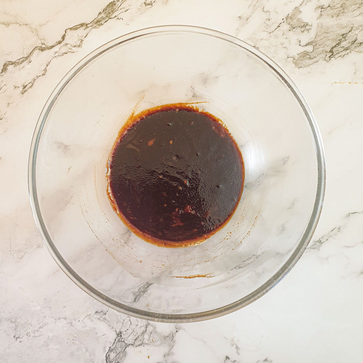 Pork rib marinade in a glass bowl.