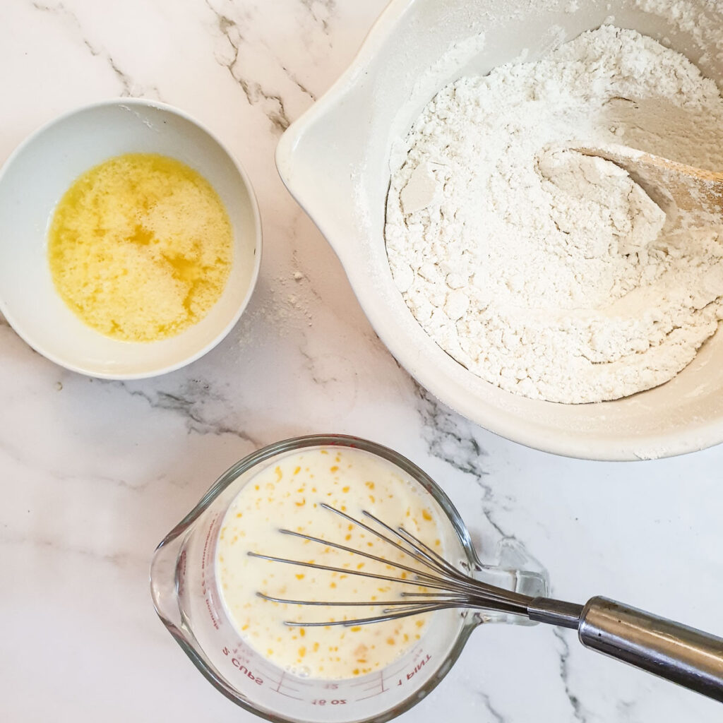Three bowl, one with melted butter, one with flour and  third with milk and beaten egg.